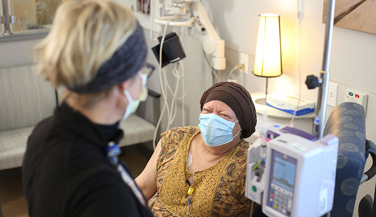 a nurse providing chemotherapy drugs for a cancer patient
