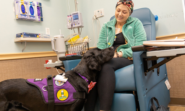 Alicia Plante, a 33-year-old oncology patient at Memorial Hospital, meeting Haze, the Oncology Dog