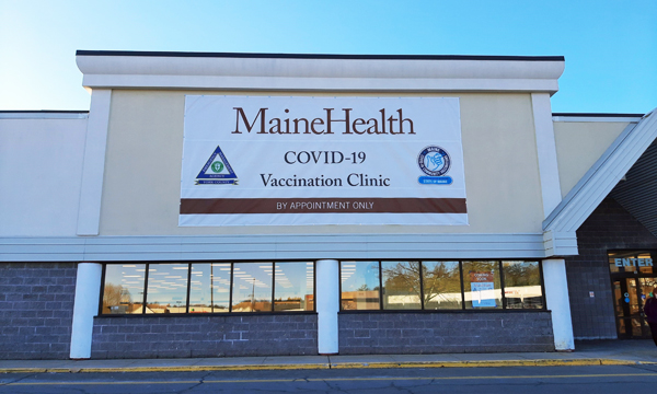 Exterior sign for the Sanford COVID-19 vaccination clinic building