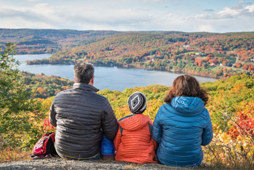 Parents with child enjoying a mountain view